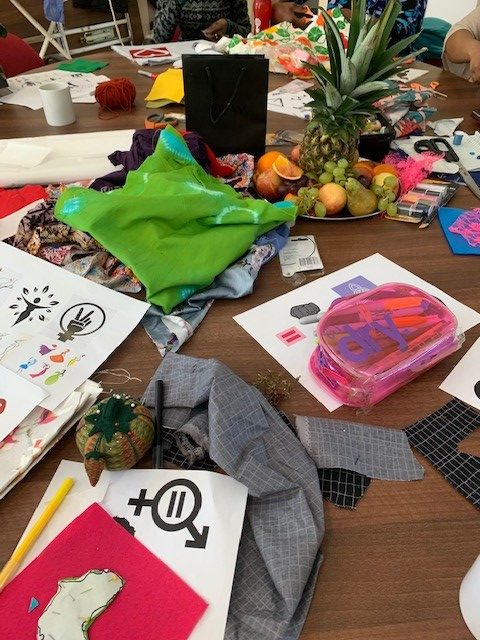 Close up shot of paper and fabric pieces used to make a wall hanging for International Women's Day 2020.
