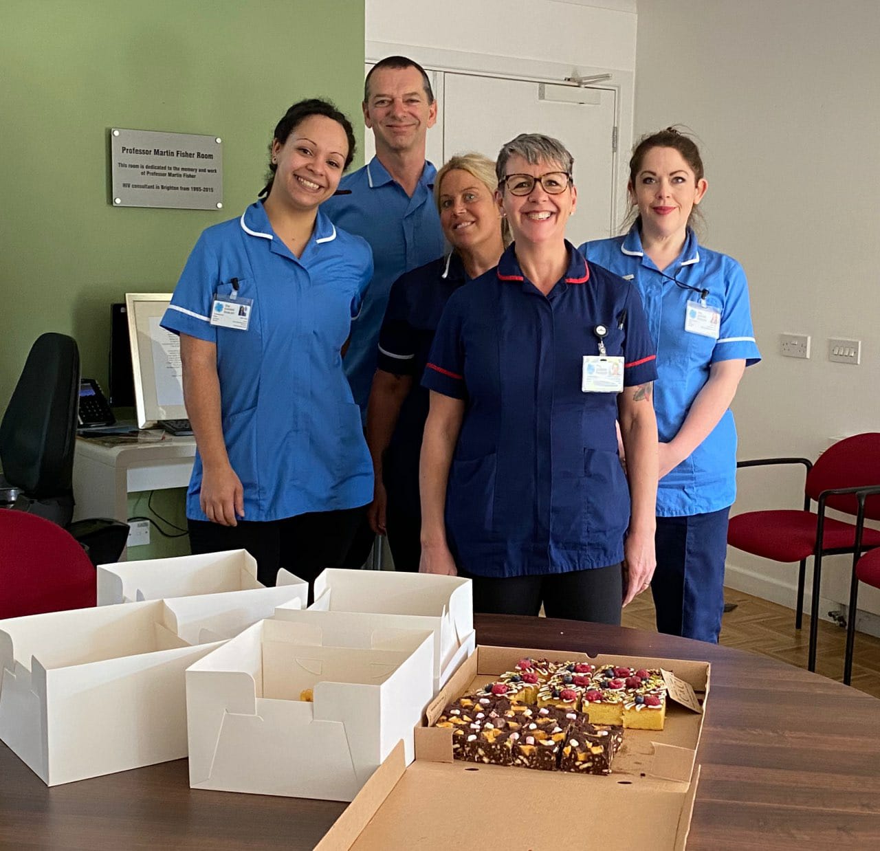 Nurses and healthcare assistants with food provided by Connie & Cooper catering